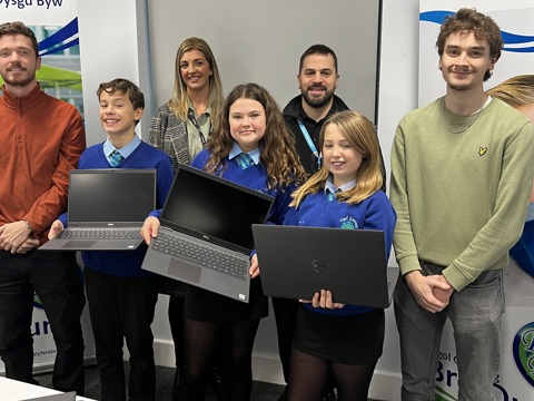 Computers being presented to Bro Dur students