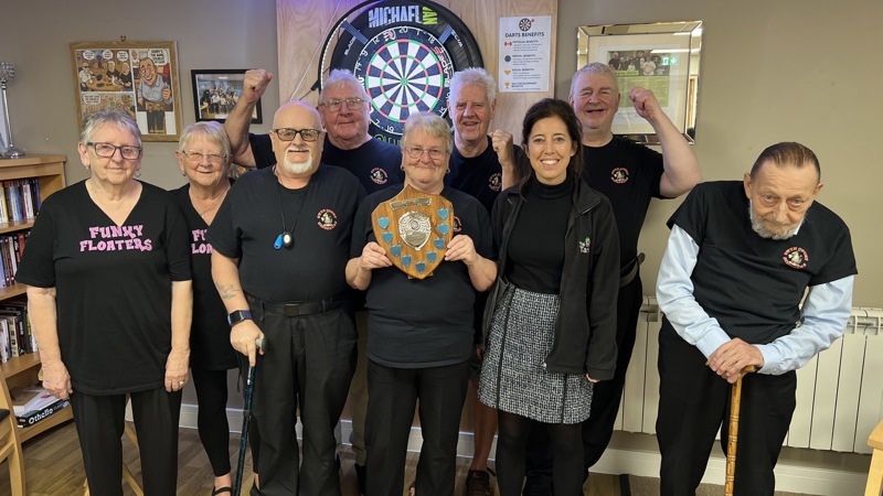 Gwyn Court Dinosaurs holding their trophy