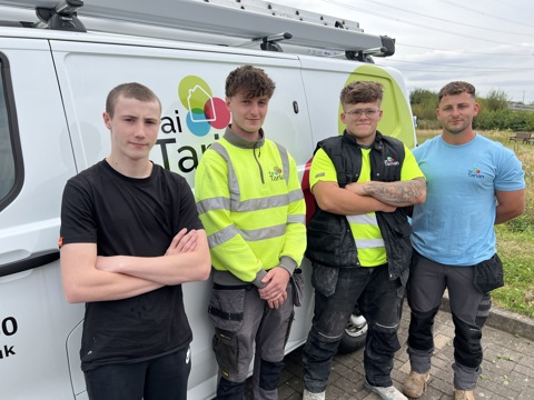 Our new apprentices next to a Tai Tarian van