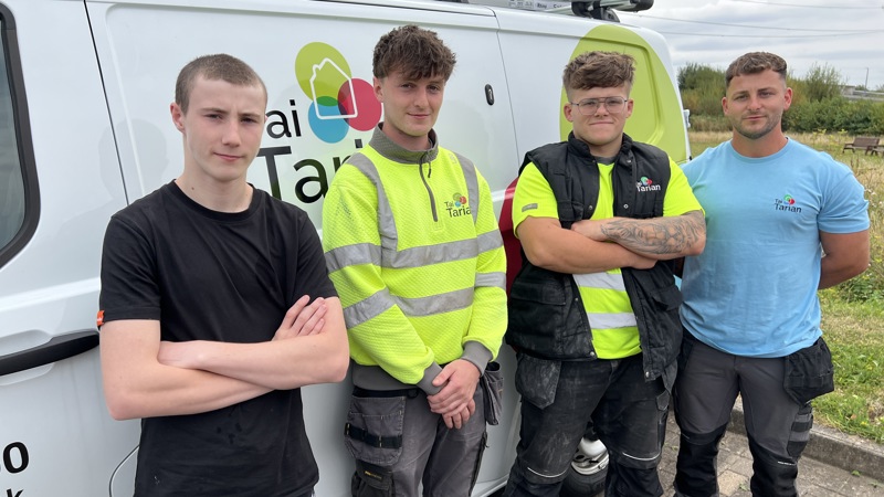 Our new apprentices next to a Tai Tarian van