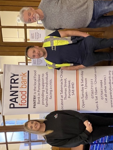 A donation being made to a foodbank