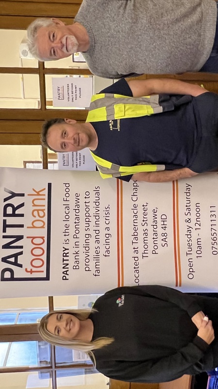 A donation being made to a foodbank