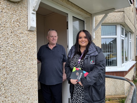 Tai Tarian staff member speaking with a tenant on the doorstep