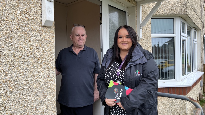 Tai Tarian staff member speaking with a tenant on the doorstep