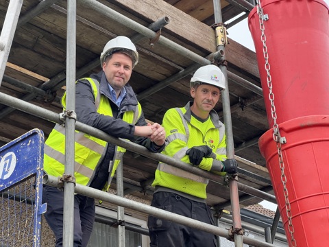 Six of the repairs team outside Tai Tarian head office