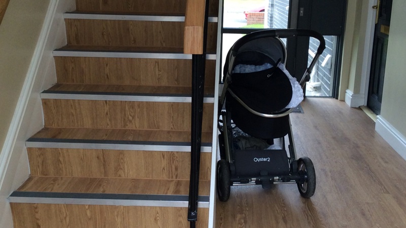 A pram causing an obstruction in a hallway