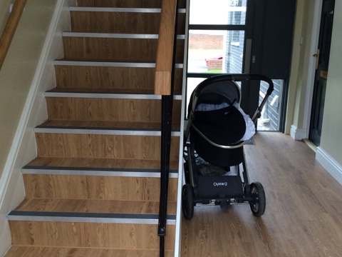 A pram causing an obstruction in a hallway
