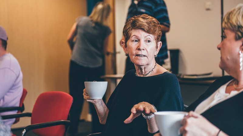 Tai Tarian tenants having a chat with a cup of tea