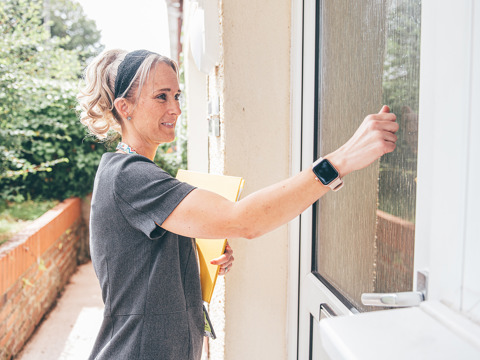 A Tai Tarian colleague knocks on a tenant's door